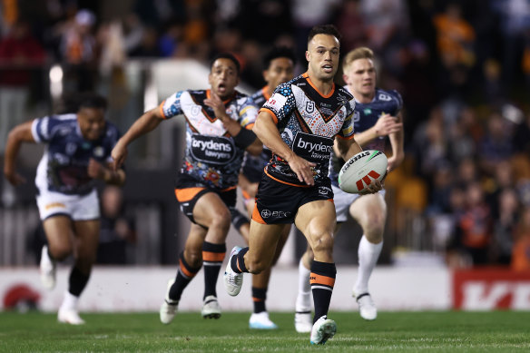 Wests Tigers halfback Luke Brooks makes a break on Saturday night.