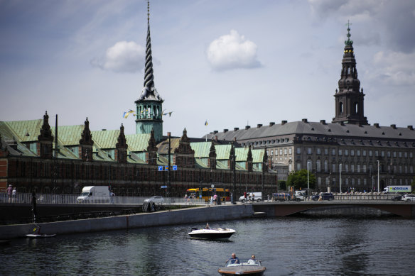 The Old Stock Exchange building (left) photographed from across the water in 2022.