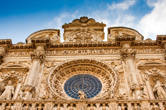 The ornate baroque facade of the Basilica di Santa Croce in Lecce.