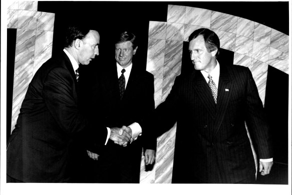 Paul Keating and John Hewson shake hands before their 1993 debate on national television. 