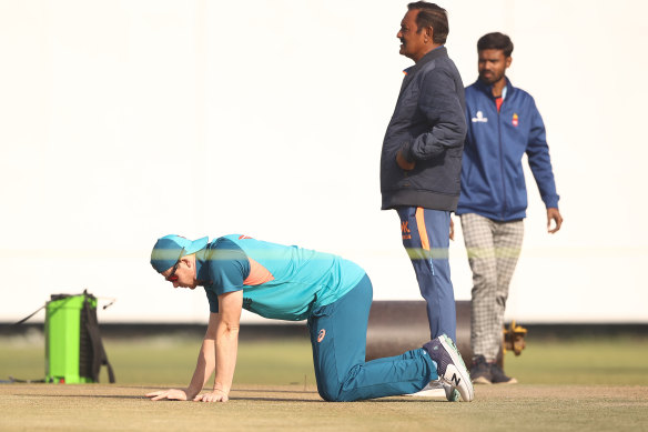 Steve Smith checks the pitch ahead of the second Test in Delhi.