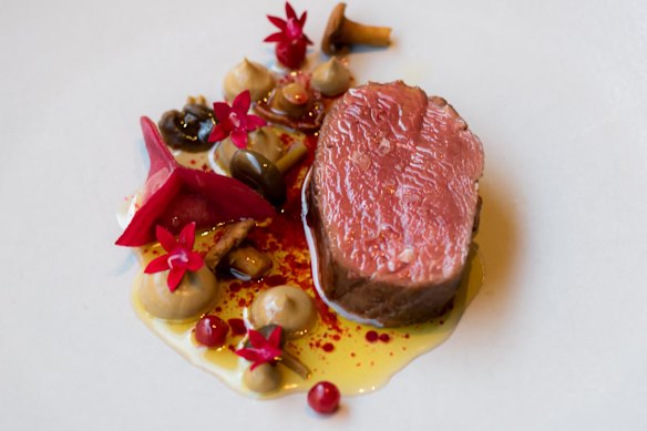 A dish of Venison, lingonberries and brown butter mushrooms at Natura restaurant.