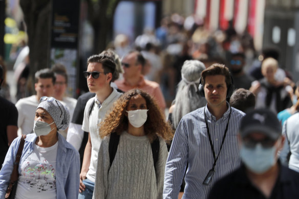 The new guidance still calls for wearing masks in crowded indoor settings like buses, planes, hospitals, prisons and homeless shelters.