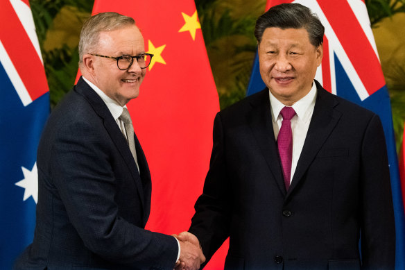 Anthony Albanese and Xi Jinping greet each other in Bali on Tuesday night.