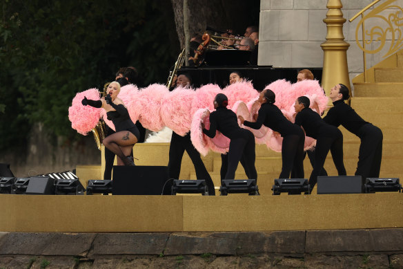 Lady Gaga performs at Square Barye during the athletes’ parade on the River Seine.