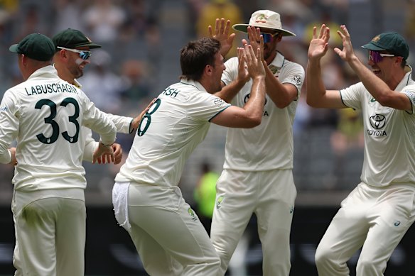 Mitchell Marsh of Australia celebrates the wicket of Babar Azam on day three at Optus Stadium.