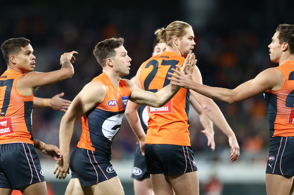 Toby Greene and teammates celebrate a goal.