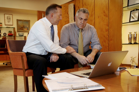 Once bitten: prime minister Tony Abbott and treasurer Joe Hockey prepare for the 2015 budget after their ill-fated first outing in 2014. 