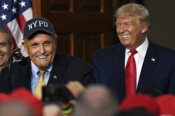 Rudy Giuliani, pictured with Donald Trump in 2020, has had his law licence suspended in New York.