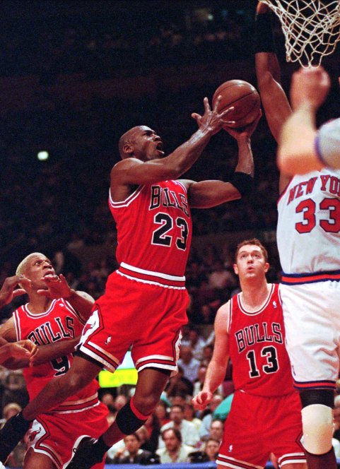 The Chicago Bulls’ Michael Jordan drives to the basket against the New York Knicks.
