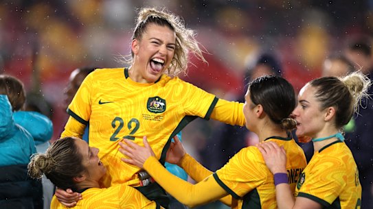 Charlie Grant celebrates with her team after the 2-0 victory over the Lionesses.