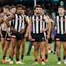 The Magpies look dejected after a loss.