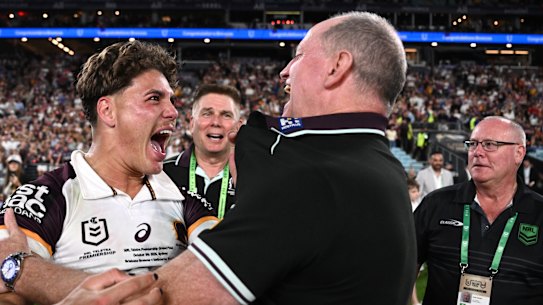 Reece Walsh and coach Michael Maguire celebrate on Sunday night.