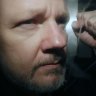 WikiLeaks founder Julian Assange being taken from court on Wednesday.