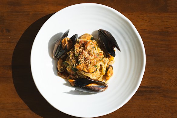 Spaghetti with mussels, tomatoes, lemon butter sauce and mullet roe.