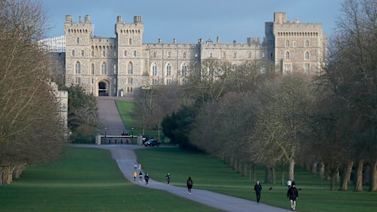 Pedestrians walk the Long Walk in front of Windsor Castle.