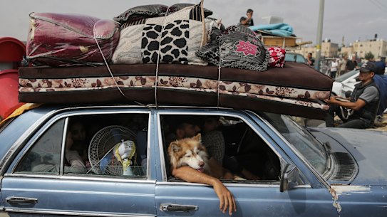 ians flee from the southern Gaza city of Rafah during an Israeli ground and air offensive in the city in May.
