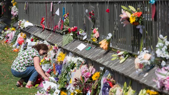 A floral tribute on the fence of the Christchurch Botanic Gardens