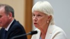 Singtel board director Gail Kelly and fellow board member John Arthur, who also serves as Optus chairman, give evidence to the Senate inquiry on Thursday.
