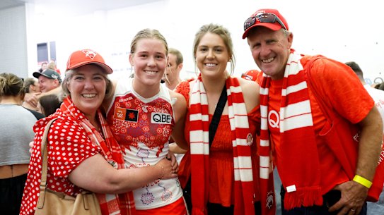 Bella Smith celebrates with family after the Swans’ win over Gold Coast.