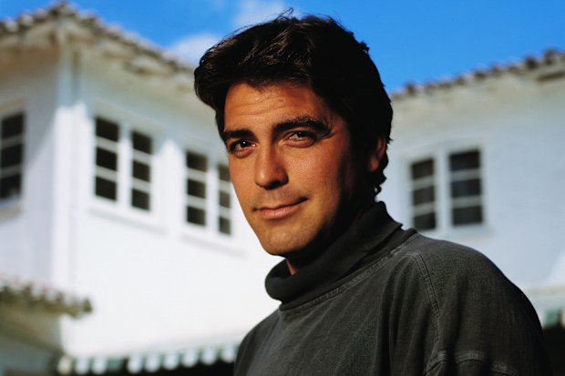 Actor George Clooney poses in grey turtleneck shirt. (Photo by  Tim Rue/CORBIS/Corbis via Getty Images)
