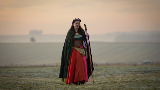 People enjoy the sunrise at Stonehenge in Amesbury, an iconic site for pre-Christian Britain.  THe site is managed by English Heritage.
