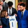 Golden State star Stephen Curry presents Vice President Kamala Harris and President Joe Biden with Warriors jerseys at the White House last year.