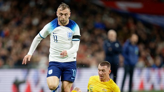 England’s Jarrod Bowen, left, duels for the ball with Australia’s Mitchell Duke during the international friendly soccer match between England and Australia at Wembley Stadium, London, Friday, Oct. 13, 2023. (AP Photo/David Cliff)