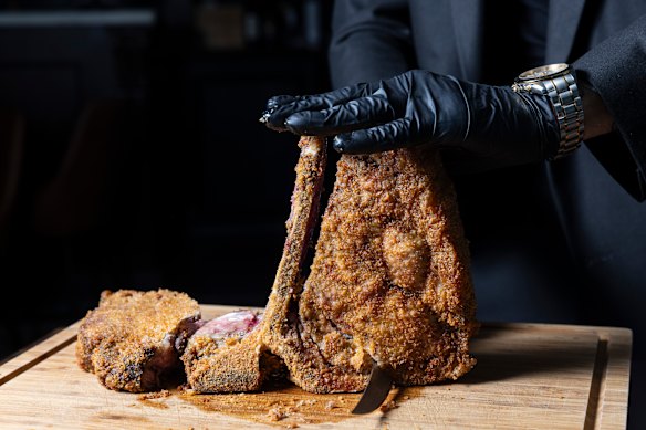 Bistecca fritta, a crumbed T-bone steak pan-fried in clarified butter then finished in the oven, is carved tableside.