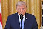President Donald Trump speaks in the East Room of the White House.