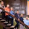 The original Brady Bunch kids in the post-renovation Brady Bunch house.