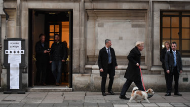 Prime Minister Boris Johnson leaves a voting booth in central London.