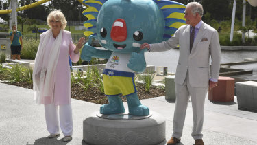 Camilla and Prince Charles pose with the Commonwealth Games mascot, Borobi. 