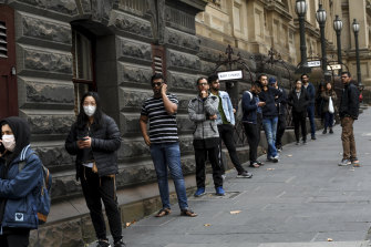 International students queuing outside Melbourne Town Hall for food vouchers in May.