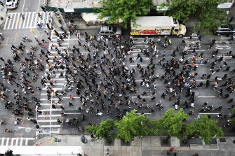 Hundreds of protesters march down Third Avenue in Manhattan.
