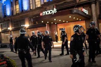 Police arrive at Macy's mall after it was broken into by people hours after a solidarity rally calling for justice over the death of George Floyd.