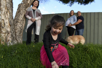 Simon Vallone and his wife Ashleigh Vandenberg, right, with their three-year-old daughter Tahlia, Ms Vandenberg's mother Charmaine, and their dog Bella at their Deer Park home. They are taking extra precautions due to Ms Vandenberg's pregnancy.