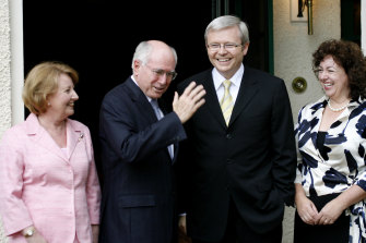 The outgoing John Howard and his wife, Janette, show prime minister-elect Kevin Rudd and his wife, Therese Rein, the Lodge in 2007.