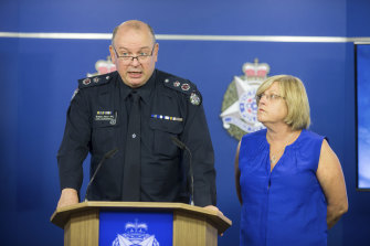 Chief Commissioner Graham Ashton with Police Minister Lisa Neville at a media conference in February.