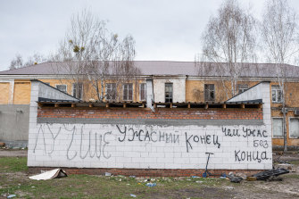 The writing on a garage says, “A horrific end is better than horror without end” in Hostomel, Ukraine. 