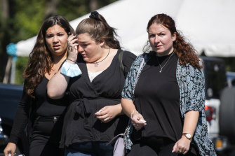 A woman wipes her tears after attending the funeral service of Gabby Petito at Moloney’s Funeral Home in Holbrook, New York