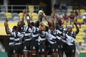 The Fijian team stands in a huddle before the start of the Oceania Sevens Challenge match between Fiji and Oceania in Townsville on June 27. The team and others from Fiji will have to make alternative arrangements to get to the Tokyo Olympics.
