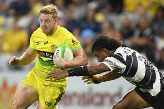 Lachlan Miller taking on Fiji in the Oceania Sevens tournament in June.