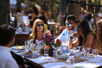 Daizy Gedeon, second from right, interviews young people over a meal in Lebanon for her new documentary.