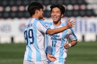Ulsan Hyudnai's Park Jeong-in (right) enjoys a goal against Shanghai Shenhua with teammate Kim Sung-joon.