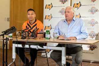 Israel Folau and Clive Palmer on Friday.