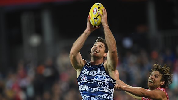 Heads up: Tom Hawkins grabs a mark ahead of Dane Rampe.