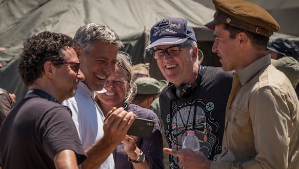 Directors Grant Heslov, George Clooney, Ellen Kuras, star Christopher Abbott with Davies on set.