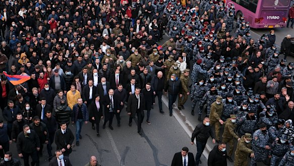 Armenian Prime Minister Nikol Pashinyan, centre front left carrying a megaphone, walks with his wife Anna Akobyan and supporters surrounded by bodyguards in Yerevan, Armenia. 