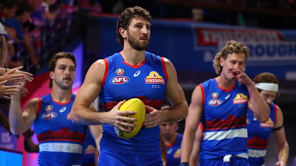 Western Bulldogs captain Marcus Bontempelli leads his team onto the field.